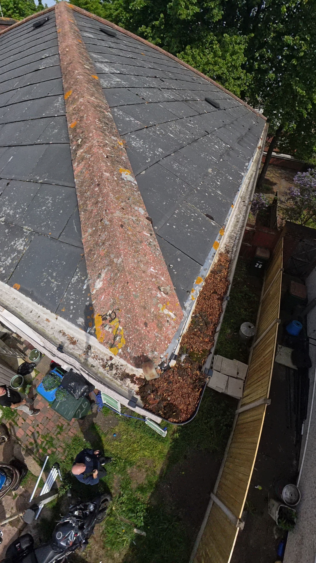 Hip-roof gutter clearance in Coventry · CV3, before pressure washing