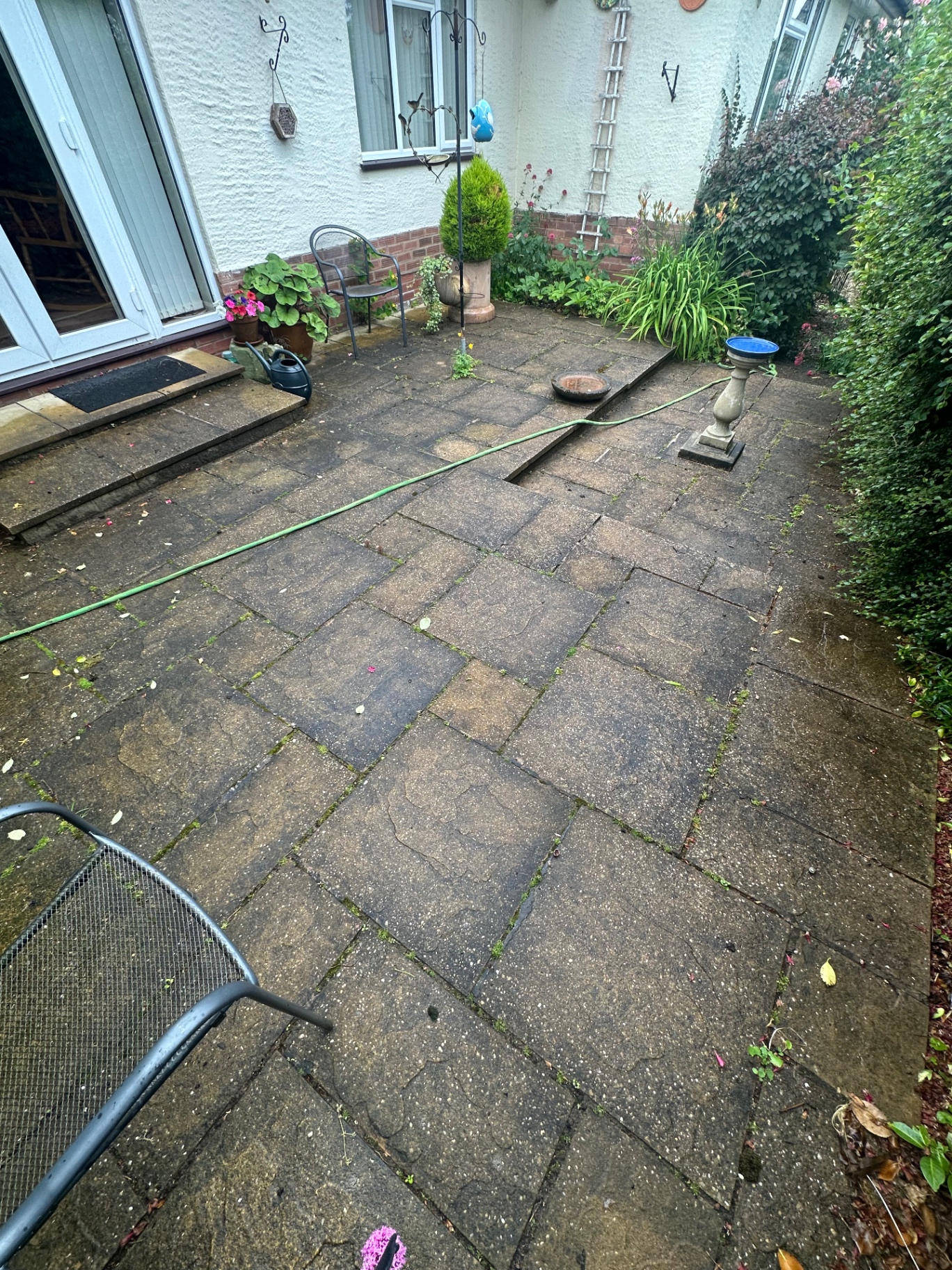 20 m² patio restored to warm tan in Rugby · CV22, before pressure washing