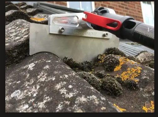 SkyScraper double Roman tile profile scraper on a pole lifting moss from the channels of concrete roof tiles