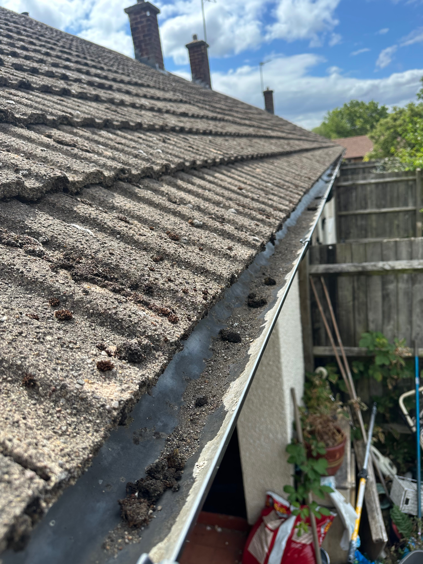 Gutter vacuum & downpipe clear, rear elevation in Coventry · CV4, before pressure washing