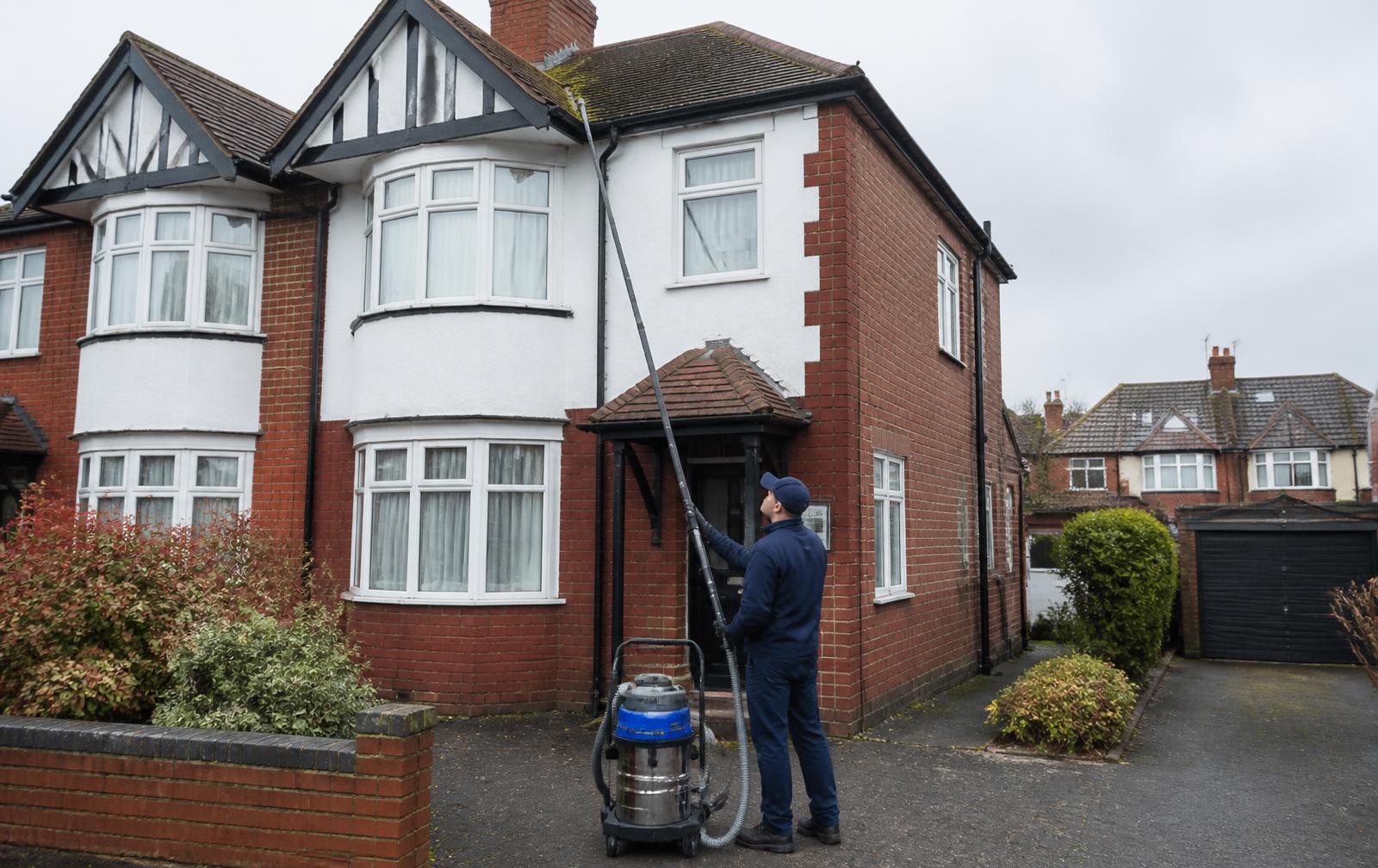 High-reach vacuum cleaning gutters on a 3-bedroom semi-detached house in Coventry Warwickshire