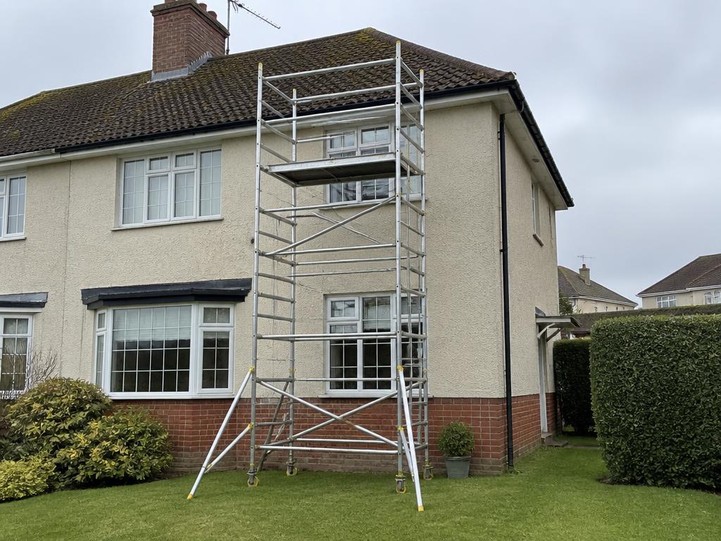 Portable scaffold tower providing safe access for roof and gutter cleaning